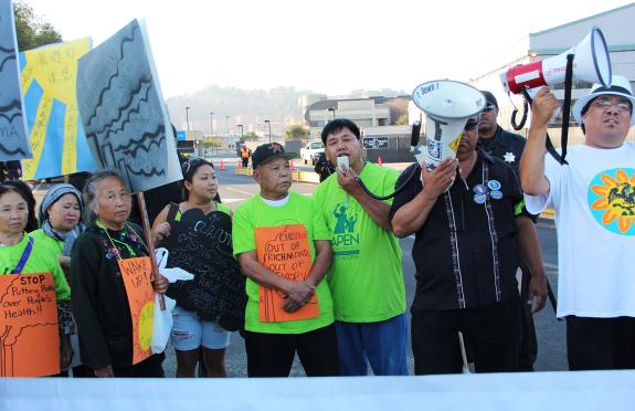 Representatives from the Asian Pacific Environmental Network spoke at Chevron's gates at a rally in October 2012. (Photo by: Sara Bernard)